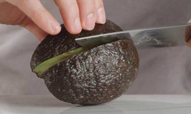 Checking avocado ripeness