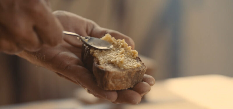 Peanut butter spread on a slice of bread